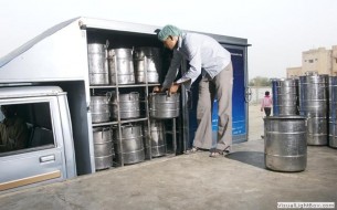 Serving mid-day meal to school children of Assam